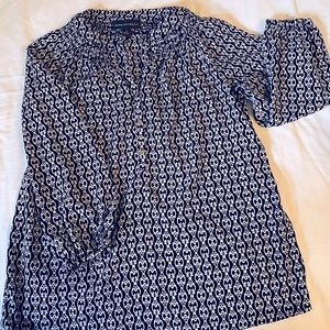 100% polyester, 3/4 length sleeves